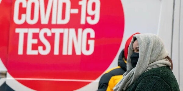 People brace against the cold while waiting for the coronavirus disease (COVID-19) test as a winter cold front hits, in New York City, U.S., January 15, 2022. David “Dee” Delgado | Reuters