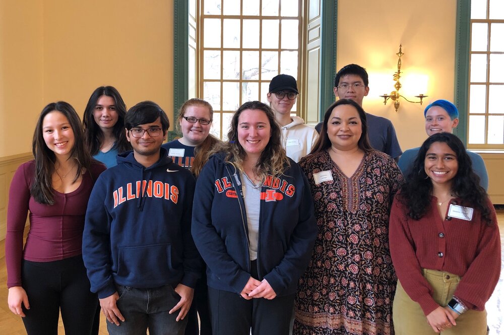 Undergraduate and graduate students participants and mentors with the Merit Program Professional Network Class gather at a year-end celebration in the Illini Union in December 2022.